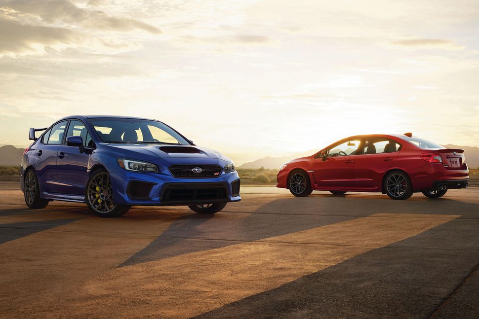 sunset view of blue and red side-by-side 2019 Subaru WRX